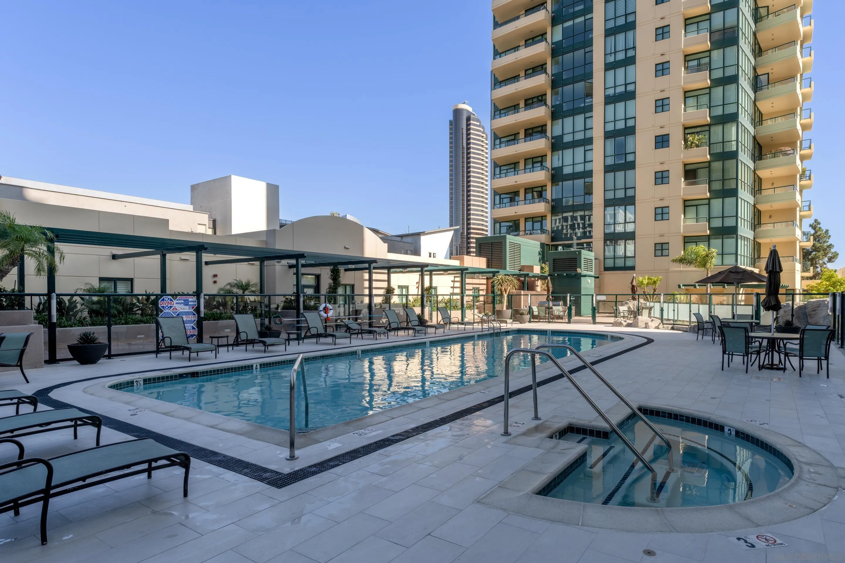 555 Front Street, Unit 303 San Diego, CA 92101 - Photo 31 of 35 a view of a swimming pool with outdoor seating
