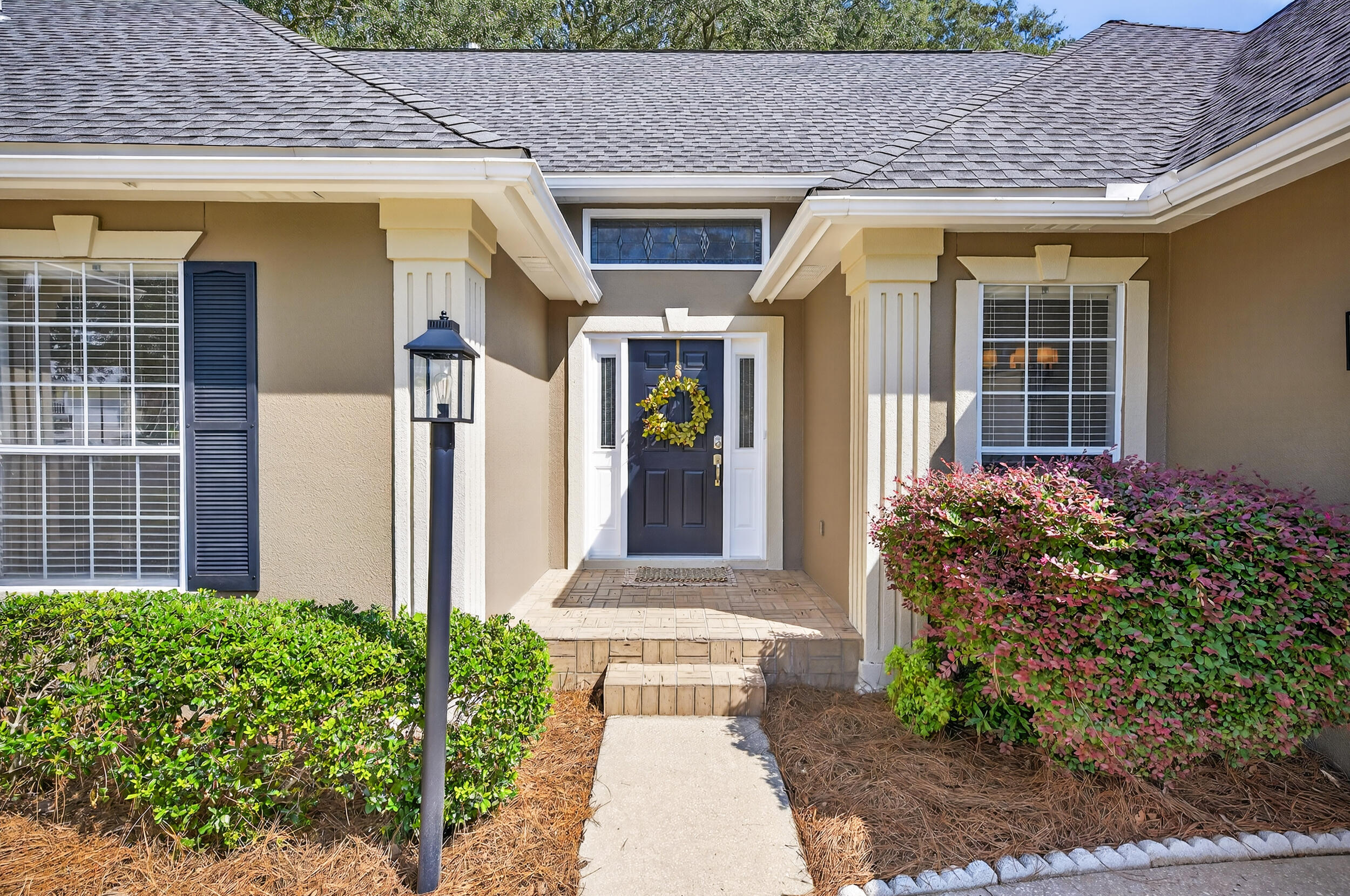 a front view of a house with garden