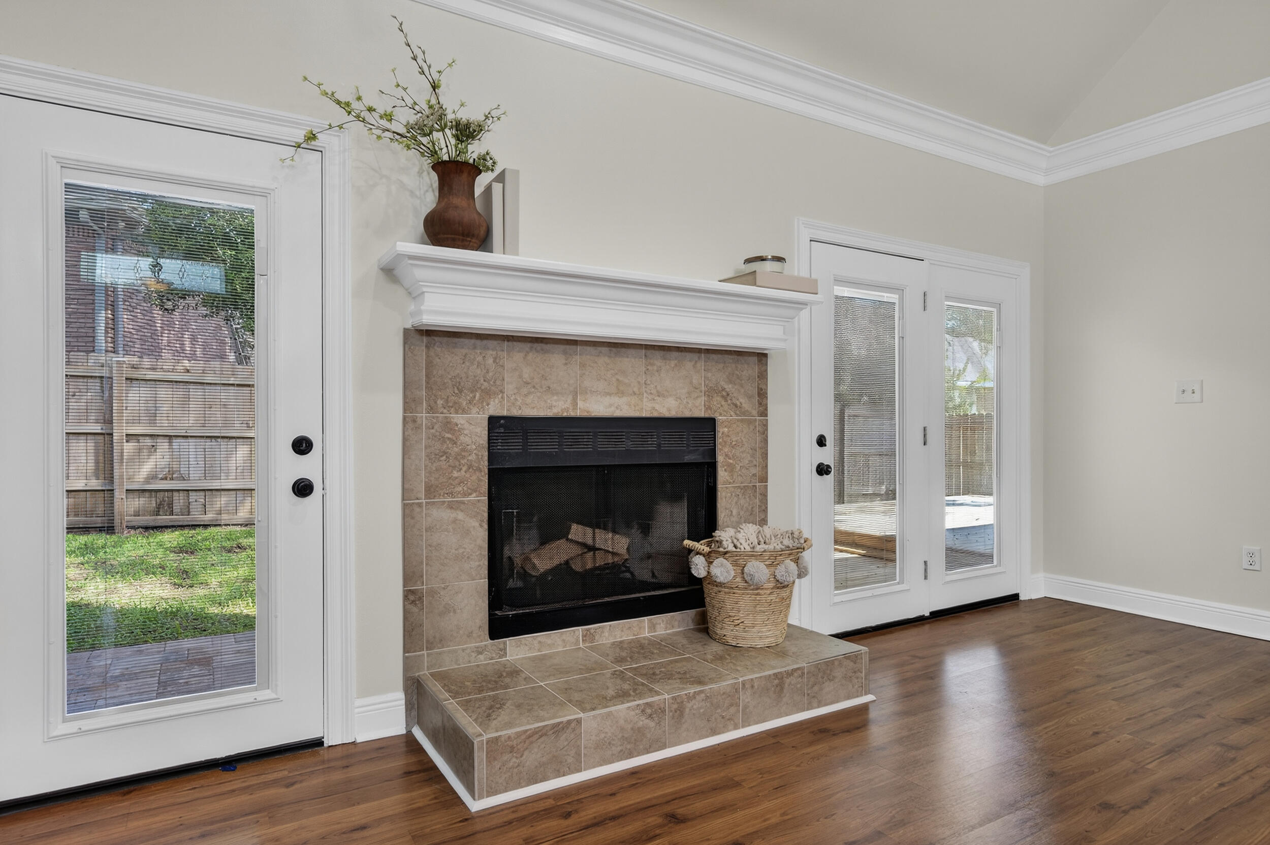2805 Sam Snead Court Shalimar, FL 32579 - Photo 11 of 56 a living room with a fireplace windows and wooden floor