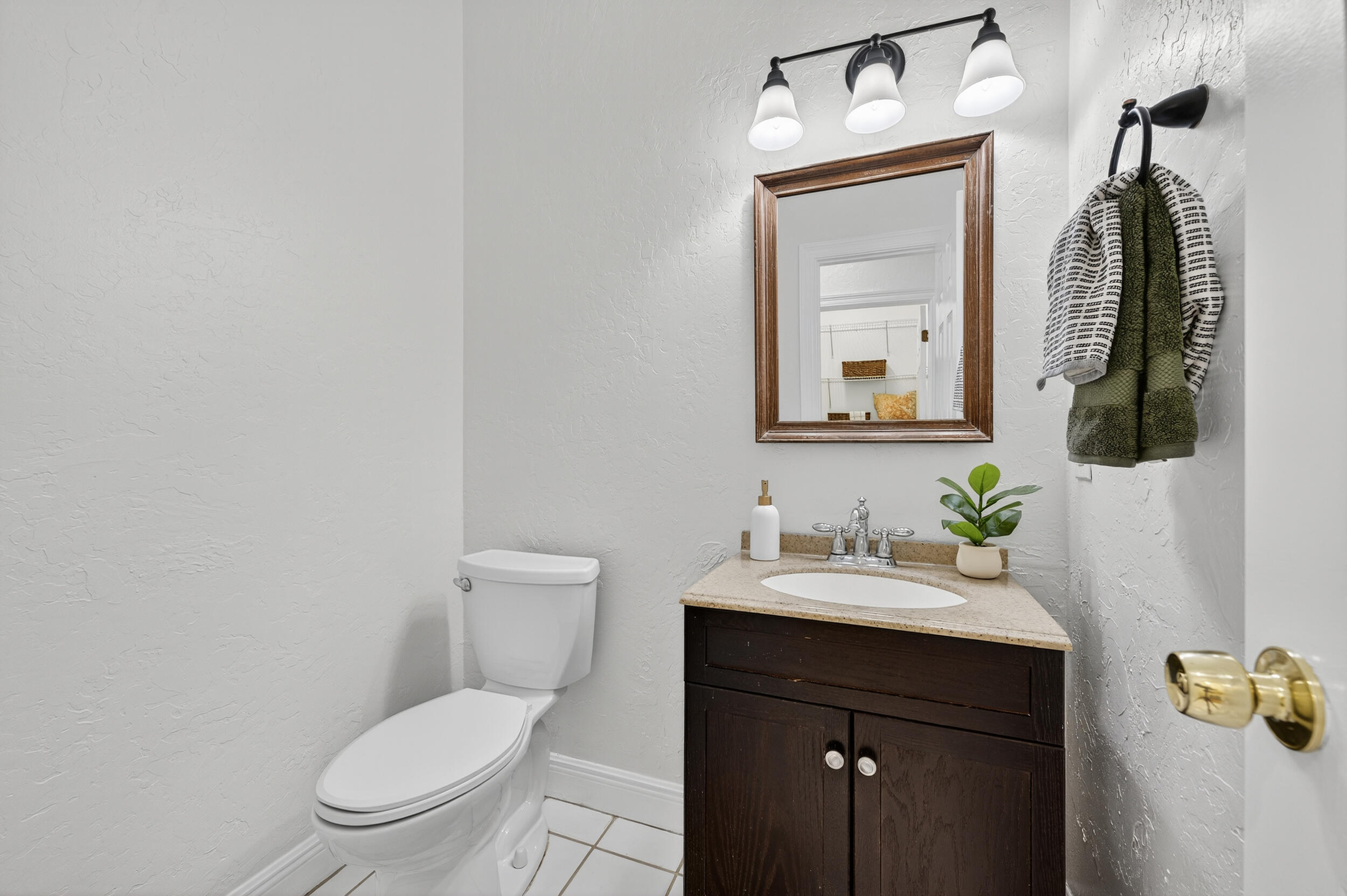 2805 Sam Snead Court Shalimar, FL 32579 - Photo 22 of 56 a bathroom with a toilet sink and mirror