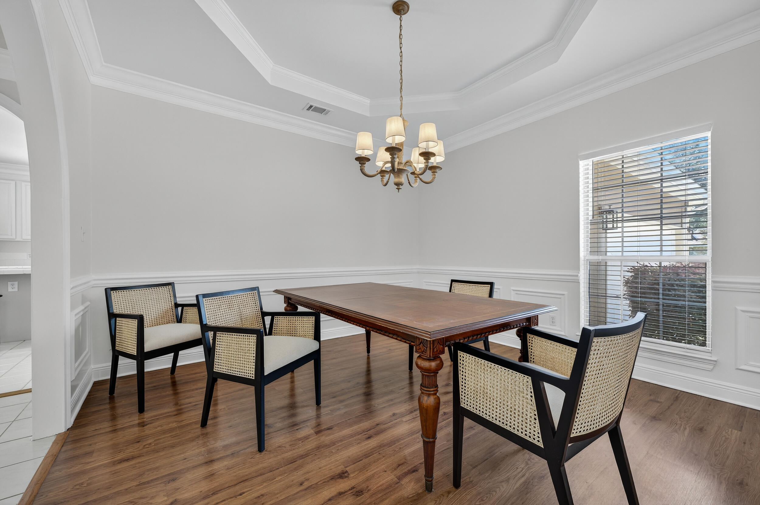 2805 Sam Snead Court Shalimar, FL 32579 - Photo 23 of 56 a view of a dining room with furniture a chandelier and wooden floor