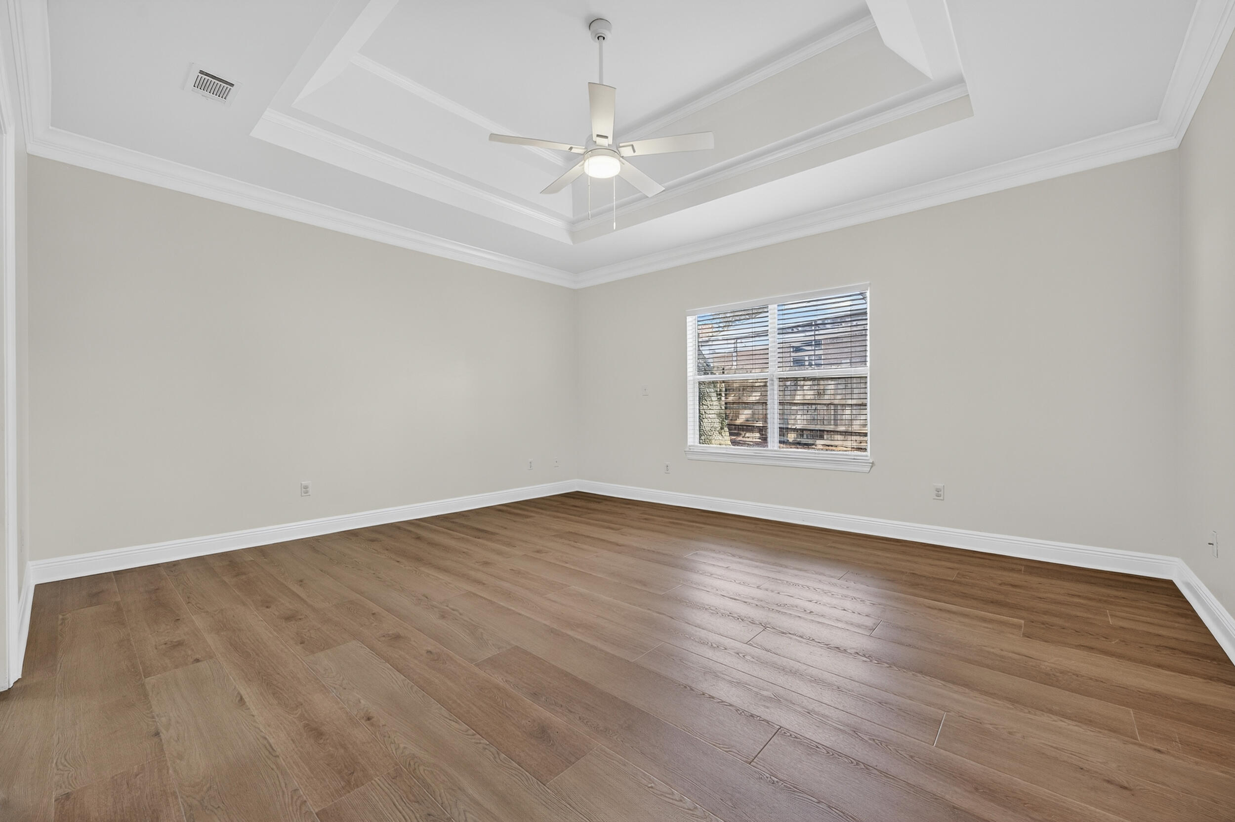 2805 Sam Snead Court Shalimar, FL 32579 - Photo 27 of 56 wooden floor in an empty room with a window