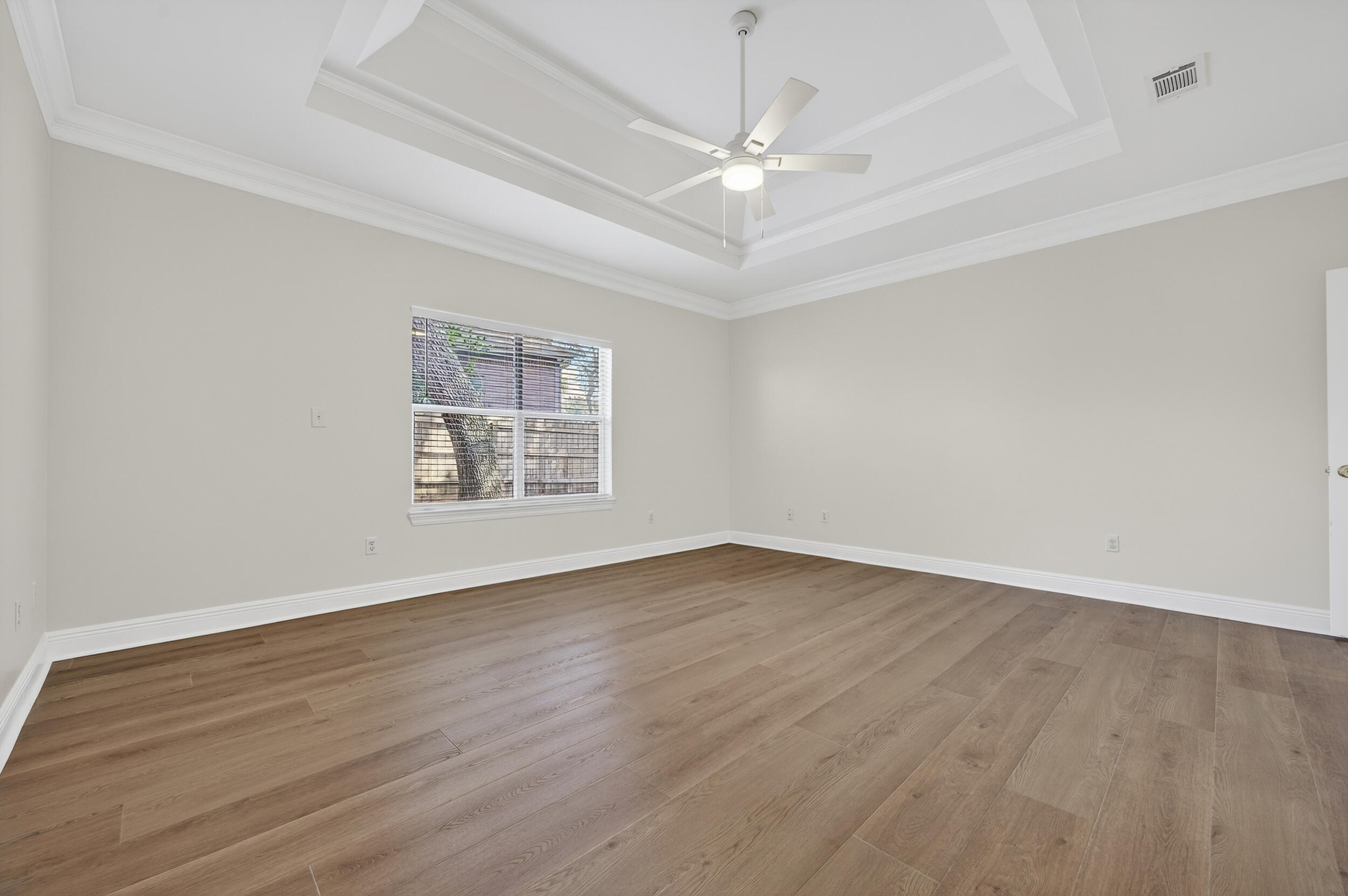 2805 Sam Snead Court Shalimar, FL 32579 - Photo 30 of 56 a view of an empty room with wooden floor and a window
