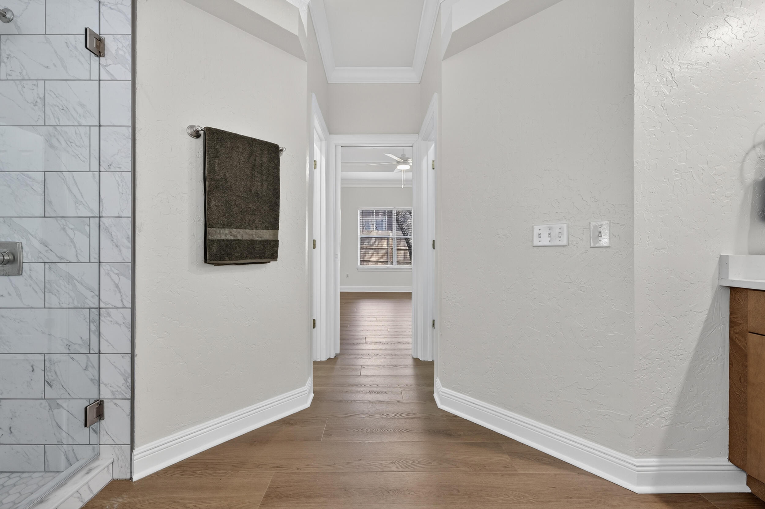 2805 Sam Snead Court Shalimar, FL 32579 - Photo 33 of 56 a view of a hallway with wooden floor and staircase