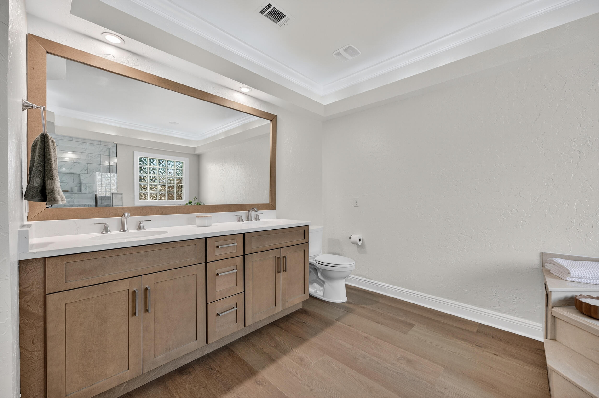 2805 Sam Snead Court Shalimar, FL 32579 - Photo 35 of 56 a spacious bathroom with a toilet a sink and mirror