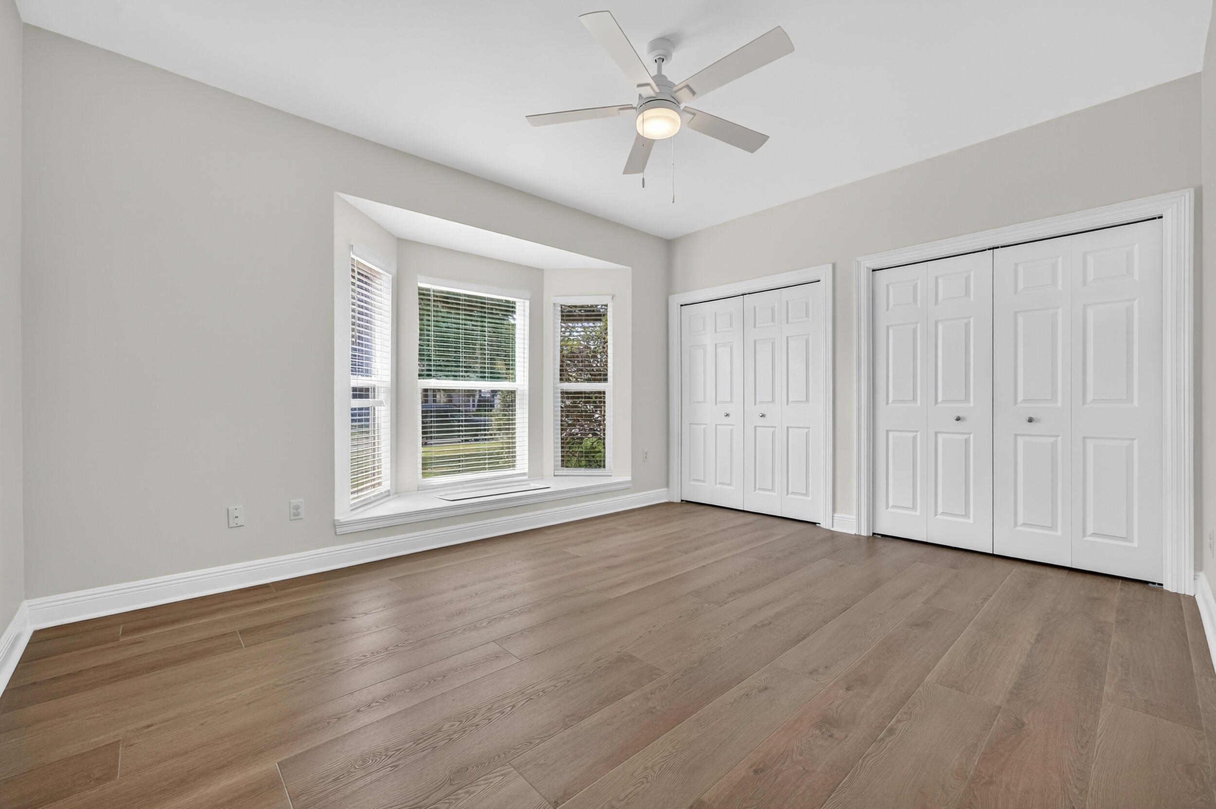 2805 Sam Snead Court Shalimar, FL 32579 - Photo 40 of 56 a view of an empty room with wooden floor and a window