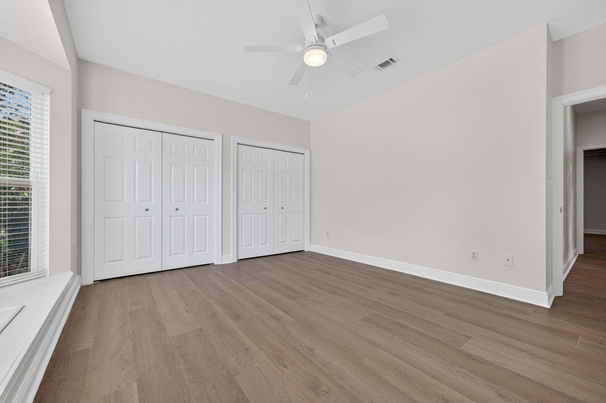 2805 Sam Snead Court Shalimar, FL 32579 - Photo 41 of 56 a view of an empty room with wooden floor