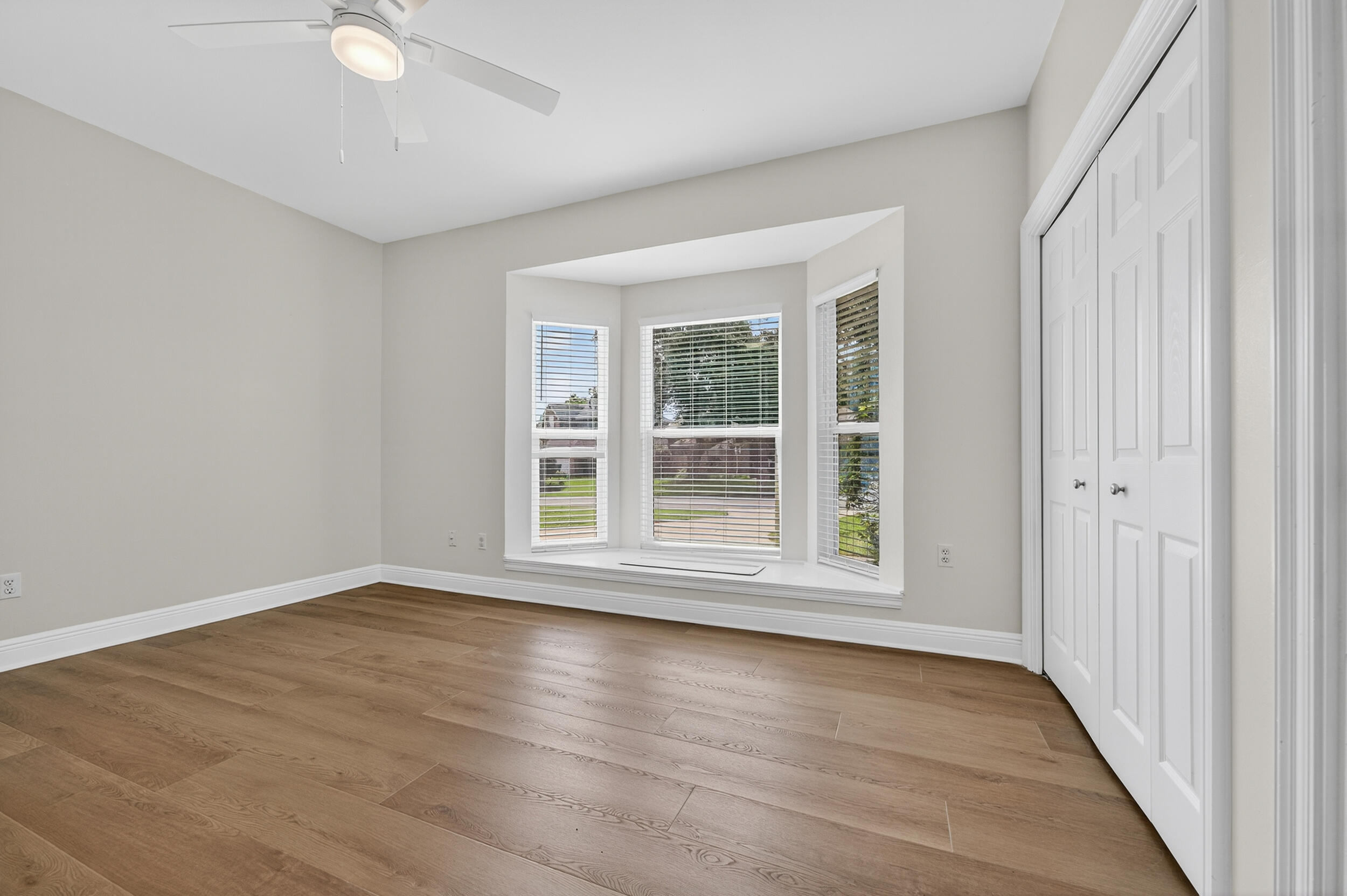 2805 Sam Snead Court Shalimar, FL 32579 - Photo 43 of 56 a view of an empty room with wooden floor and a window