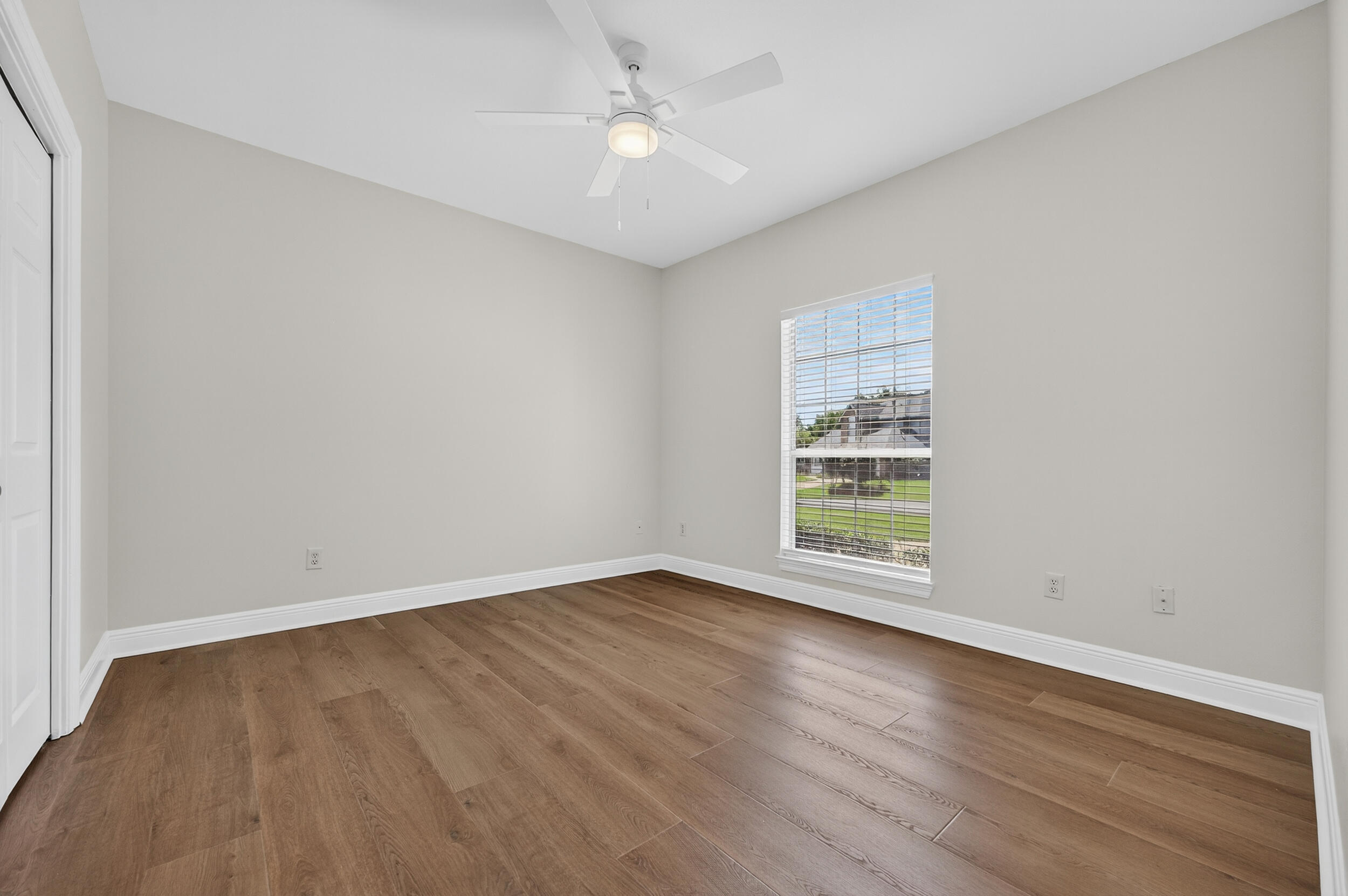 2805 Sam Snead Court Shalimar, FL 32579 - Photo 44 of 56 a view of an empty room with wooden floor and a window
