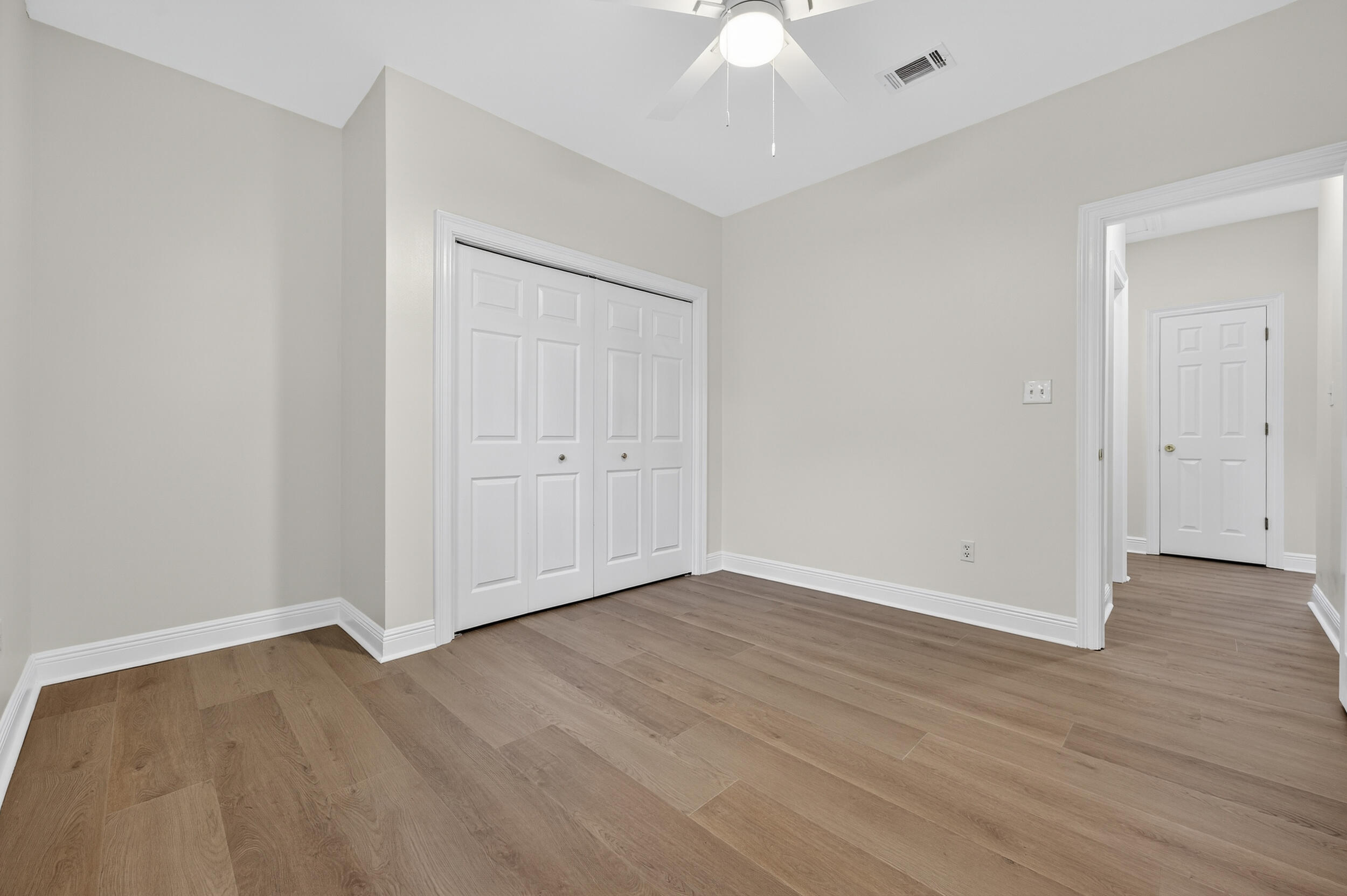 2805 Sam Snead Court Shalimar, FL 32579 - Photo 49 of 56 a view of an empty room with wooden floor