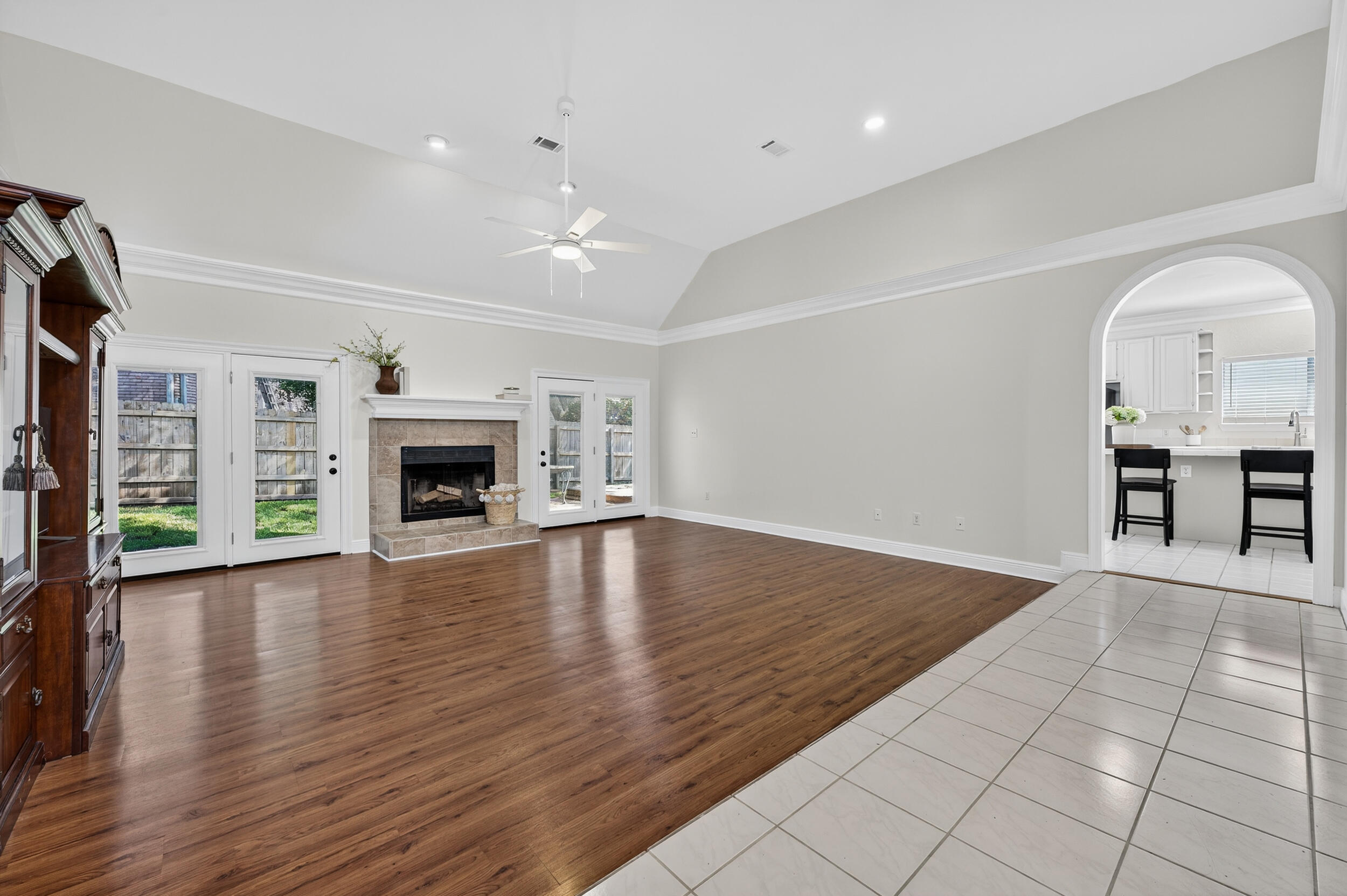 2805 Sam Snead Court Shalimar, FL 32579 - Photo 5 of 56 an empty room with wooden floor fireplace and windows