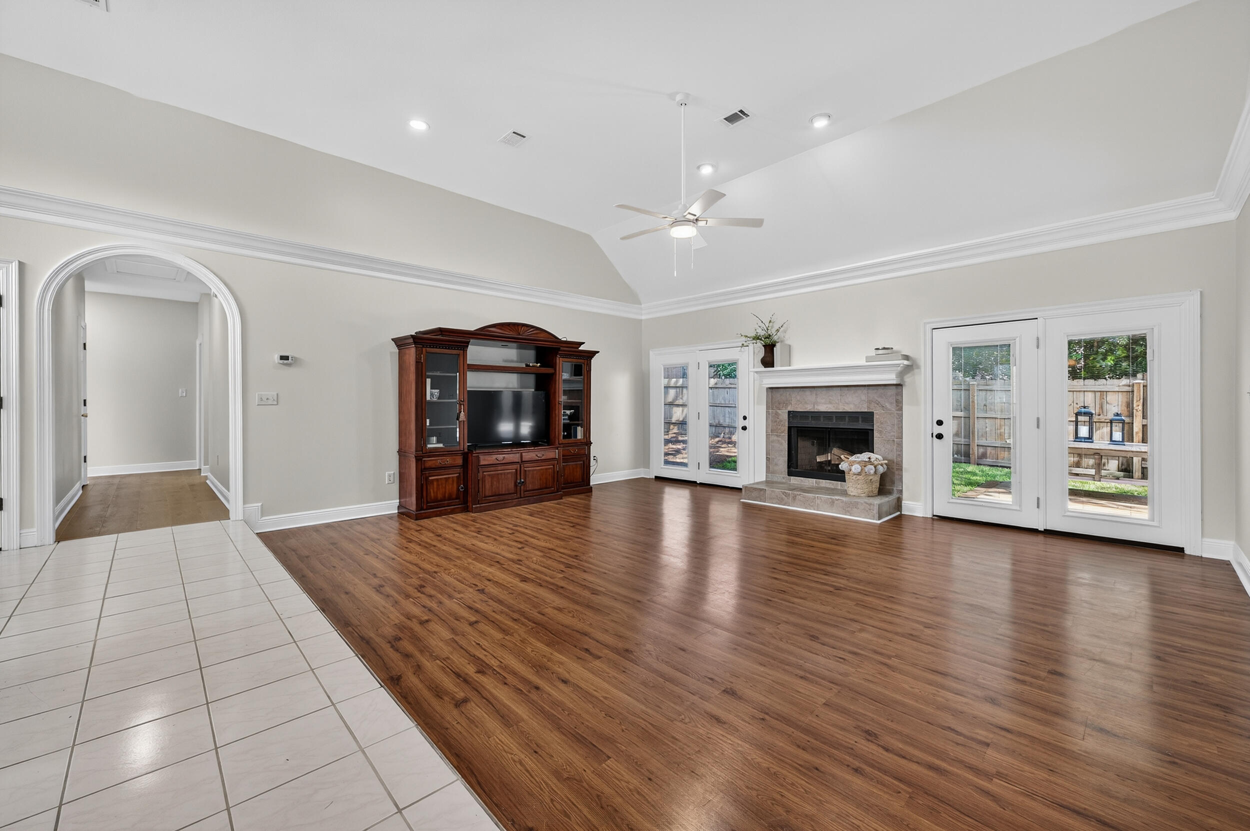 2805 Sam Snead Court Shalimar, FL 32579 - Photo 6 of 56 an empty room with fireplace and wooden floor