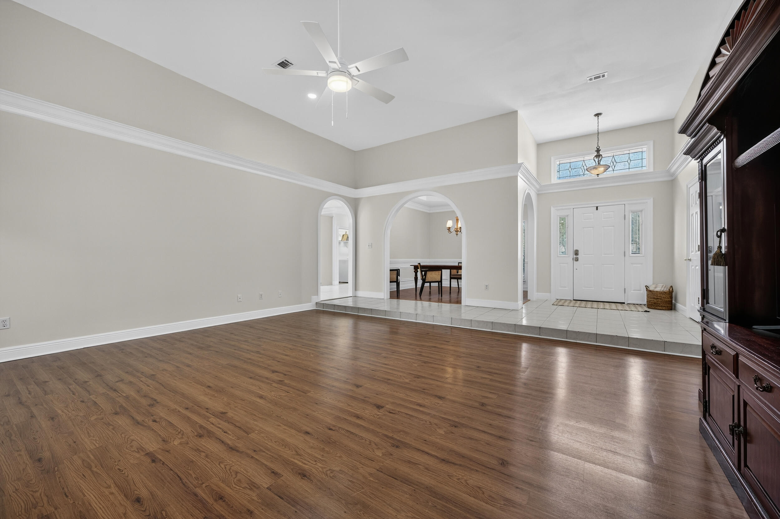 2805 Sam Snead Court Shalimar, FL 32579 - Photo 10 of 56 a view of a livingroom with wooden floor and a kitchen
