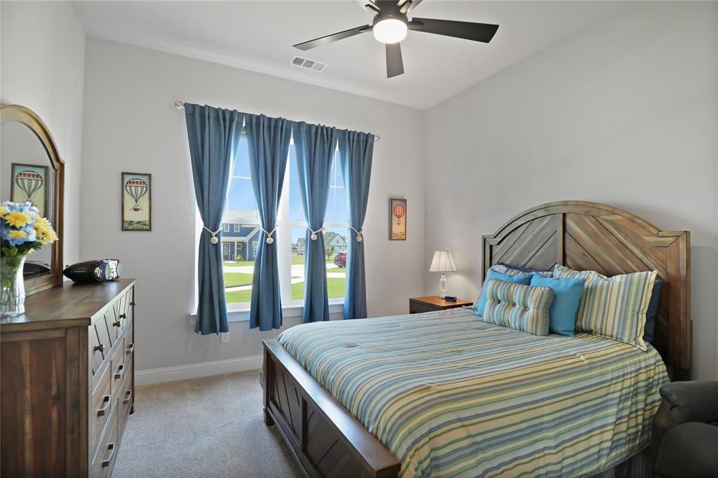 801 Lexington Lane Nevada, TX 75173 - Photo 19 of 40 Bedroom with light carpet and ceiling fan