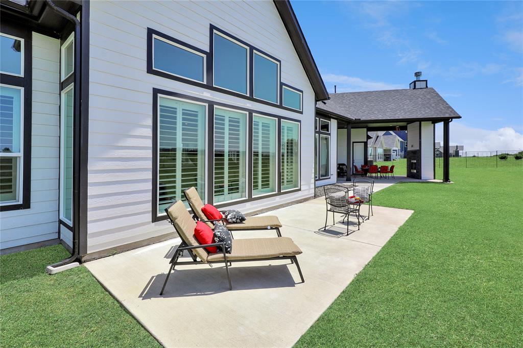 801 Lexington Lane Nevada, TX 75173 - Photo 28 of 40 Rear view of property with a lawn and a patio