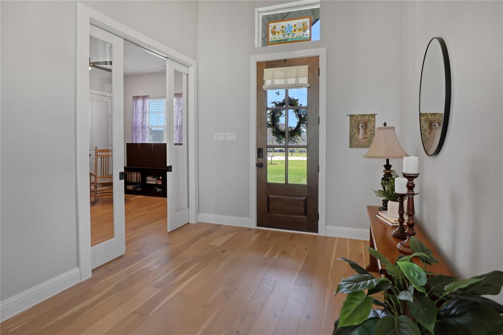 801 Lexington Lane Nevada, TX 75173 - Photo 5 of 40 Foyer featuring light wood-type flooring and baseboards