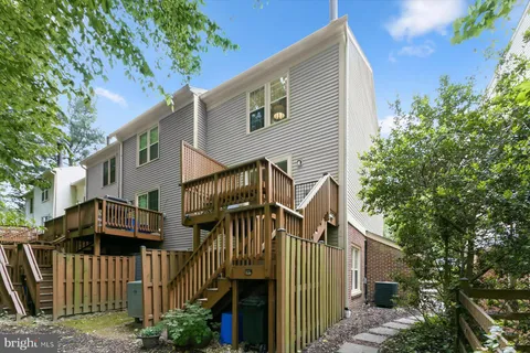 a view of a roof deck with wooden floor and fence
