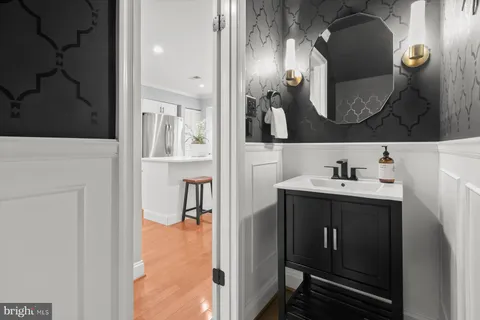 a bathroom with a sink and mirror
