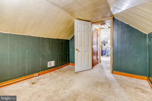 a bed room with a bed and a couch