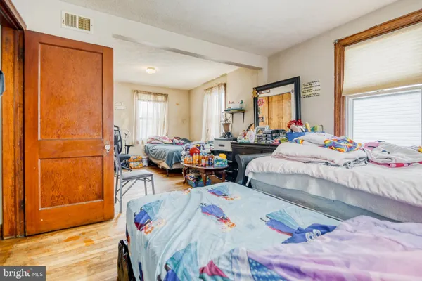 a bedroom with a bed and ceiling fan