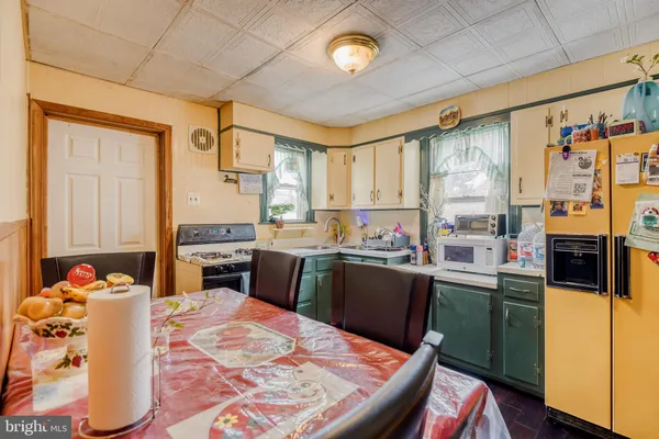 a kitchen with stainless steel appliances kitchen island granite countertop a sink and cabinets