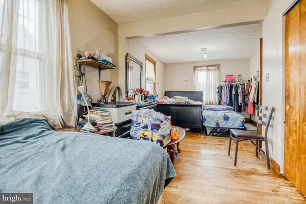 a bed room with a bed and a window