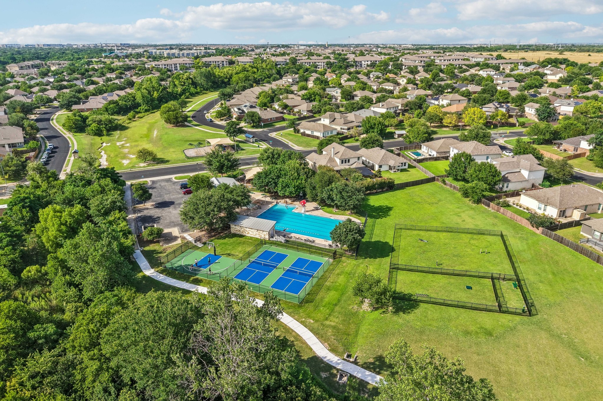 1721 Long Rifle Drive Austin, TX 78754 - Photo 38 of 38 An aerial panorama reveals a well-appointed community with extensive recreational facilities.