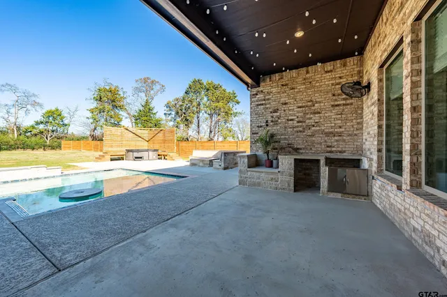 a view of open kitchen with an outdoor space and seating area