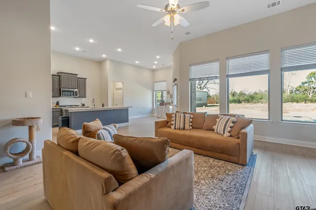 a living room with furniture and a large window