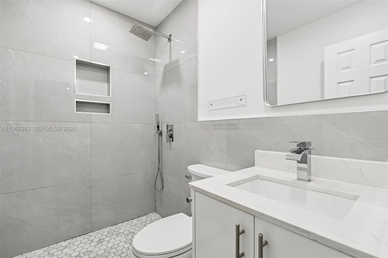 12237 Southwest 193rd Street Miami, FL 33177 - Photo 28 of 41 a bathroom with a sink toilet and vanity