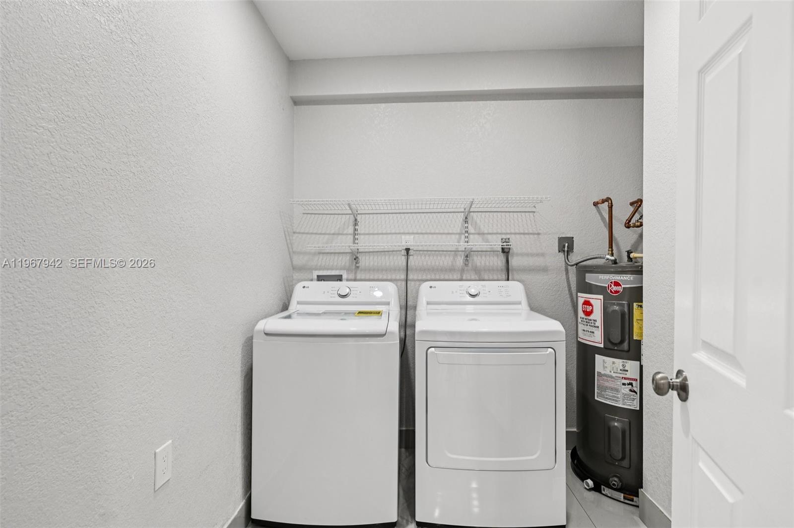 12237 Southwest 193rd Street Miami, FL 33177 - Photo 30 of 41 a utility room with dryer and washer