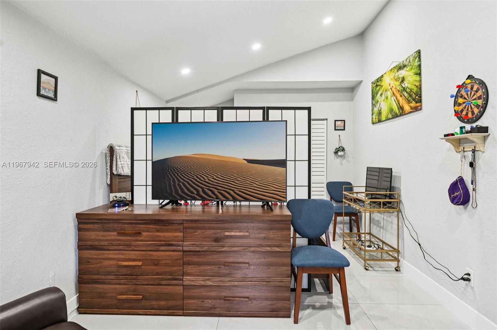 12237 Southwest 193rd Street Miami, FL 33177 - Photo 31 of 41 a living room with furniture and painting on the wall