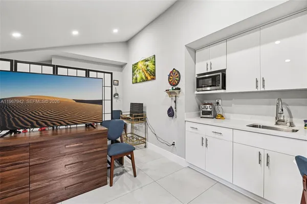 a bathroom with a sink a toilet and shower curtain