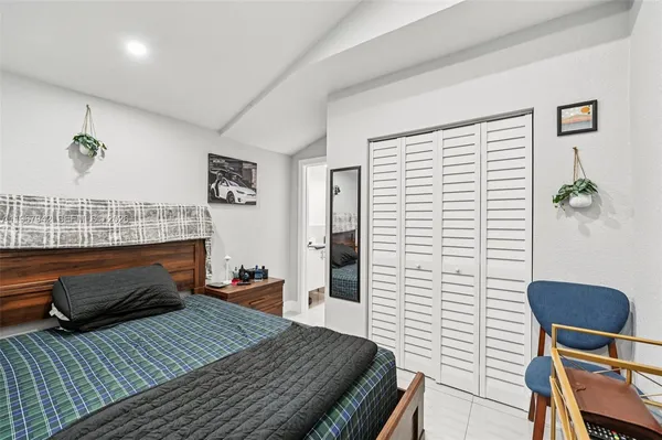 a view of a workspace with furniture and a flat screen tv