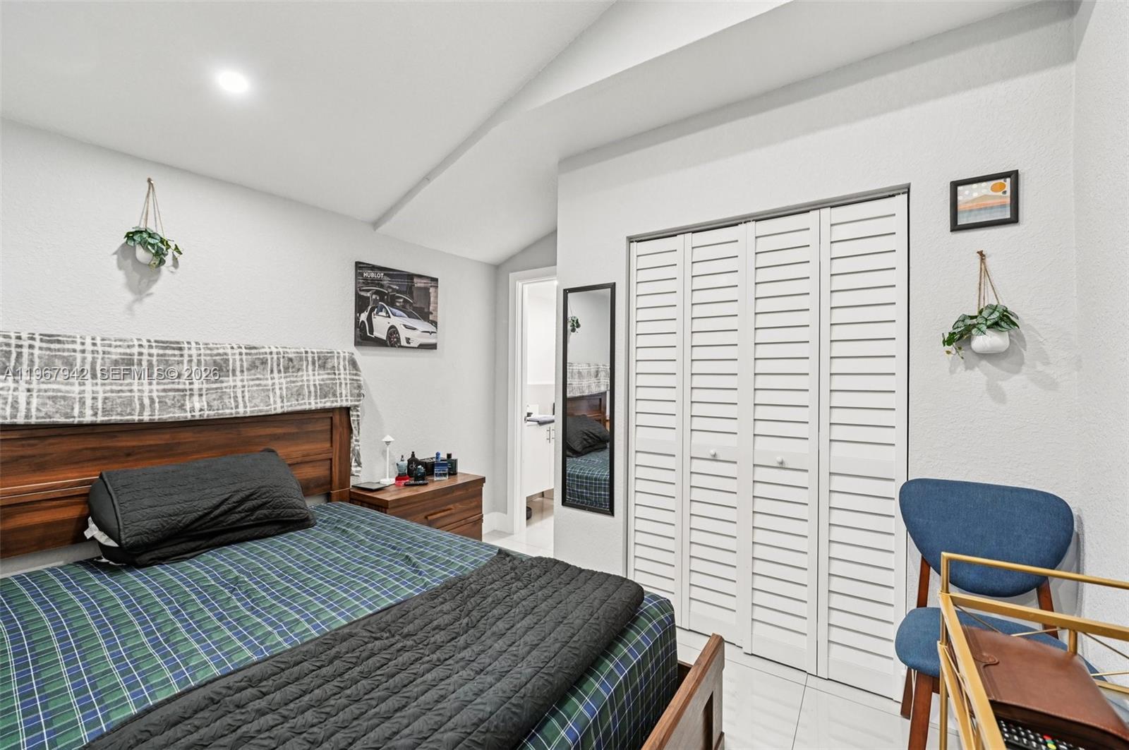 12237 Southwest 193rd Street Miami, FL 33177 - Photo 33 of 41 a bedroom with a bed and a potted plant