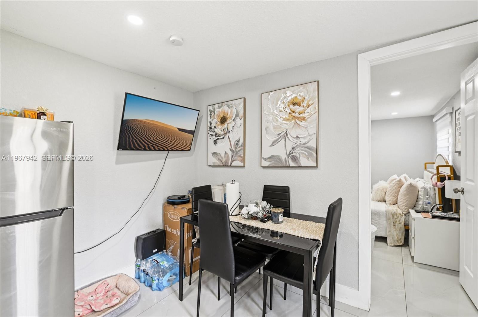12237 Southwest 193rd Street Miami, FL 33177 - Photo 35 of 41 a view of a workspace with furniture and a flat screen tv