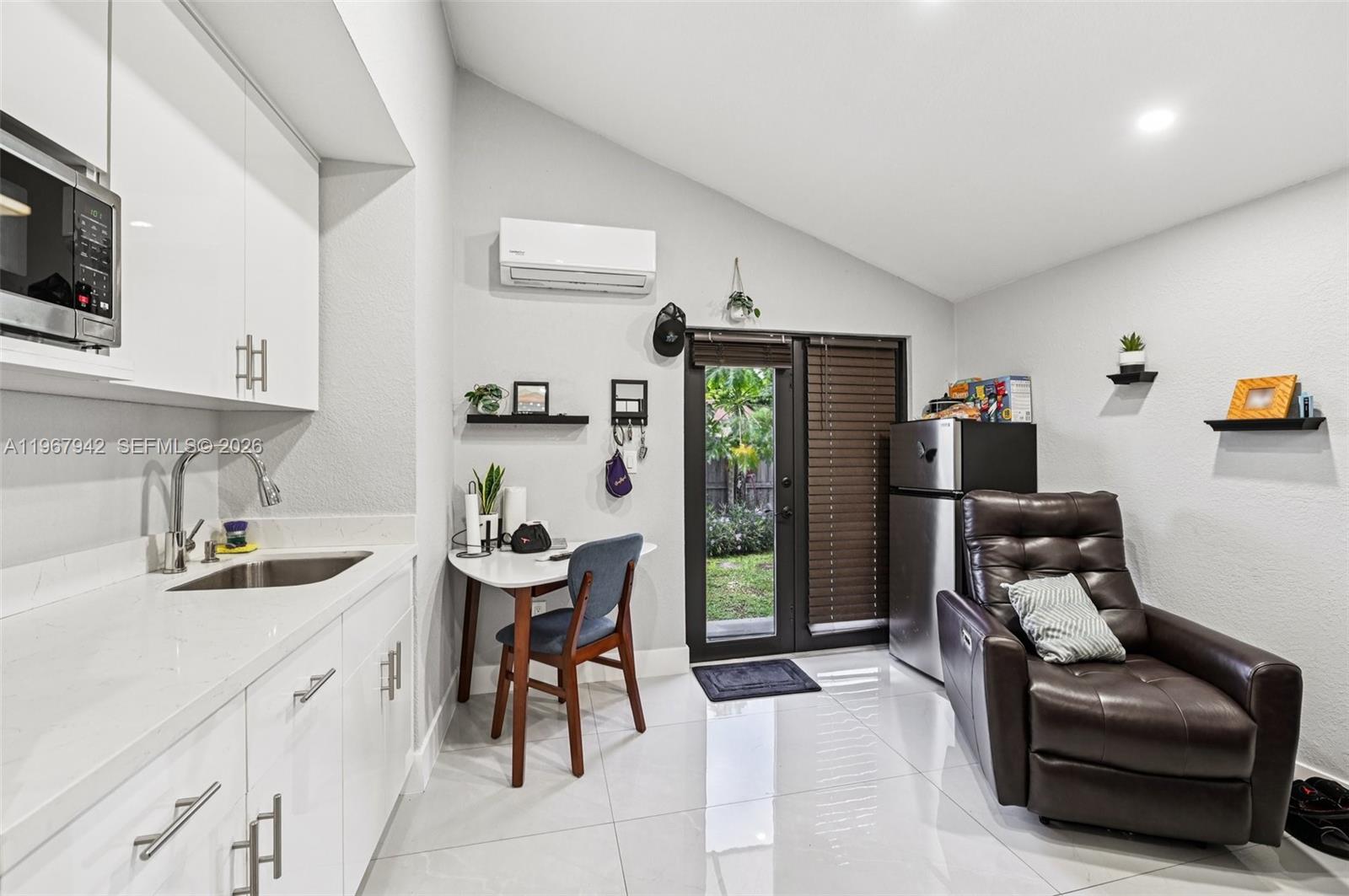 12237 Southwest 193rd Street Miami, FL 33177 - Photo 38 of 41 a kitchen with a sink cabinets and appliances