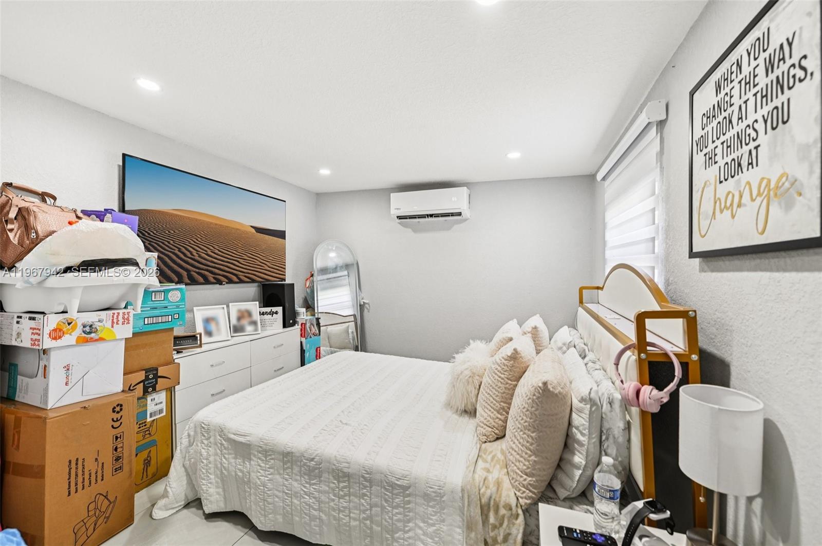 12237 Southwest 193rd Street Miami, FL 33177 - Photo 40 of 41 a bedroom with a bed and a lamp