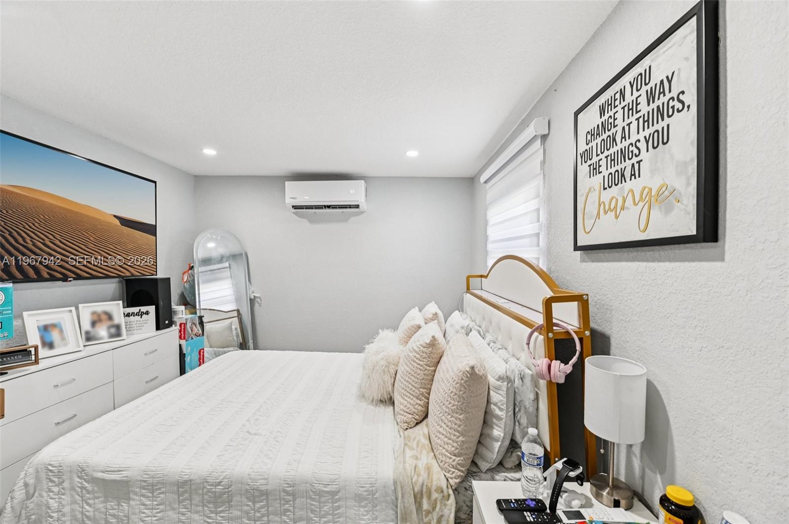 12237 Southwest 193rd Street Miami, FL 33177 - Photo 41 of 41 a bedroom with a bed and a flat screen tv