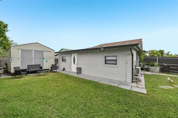 a front view of house with yard and seating area