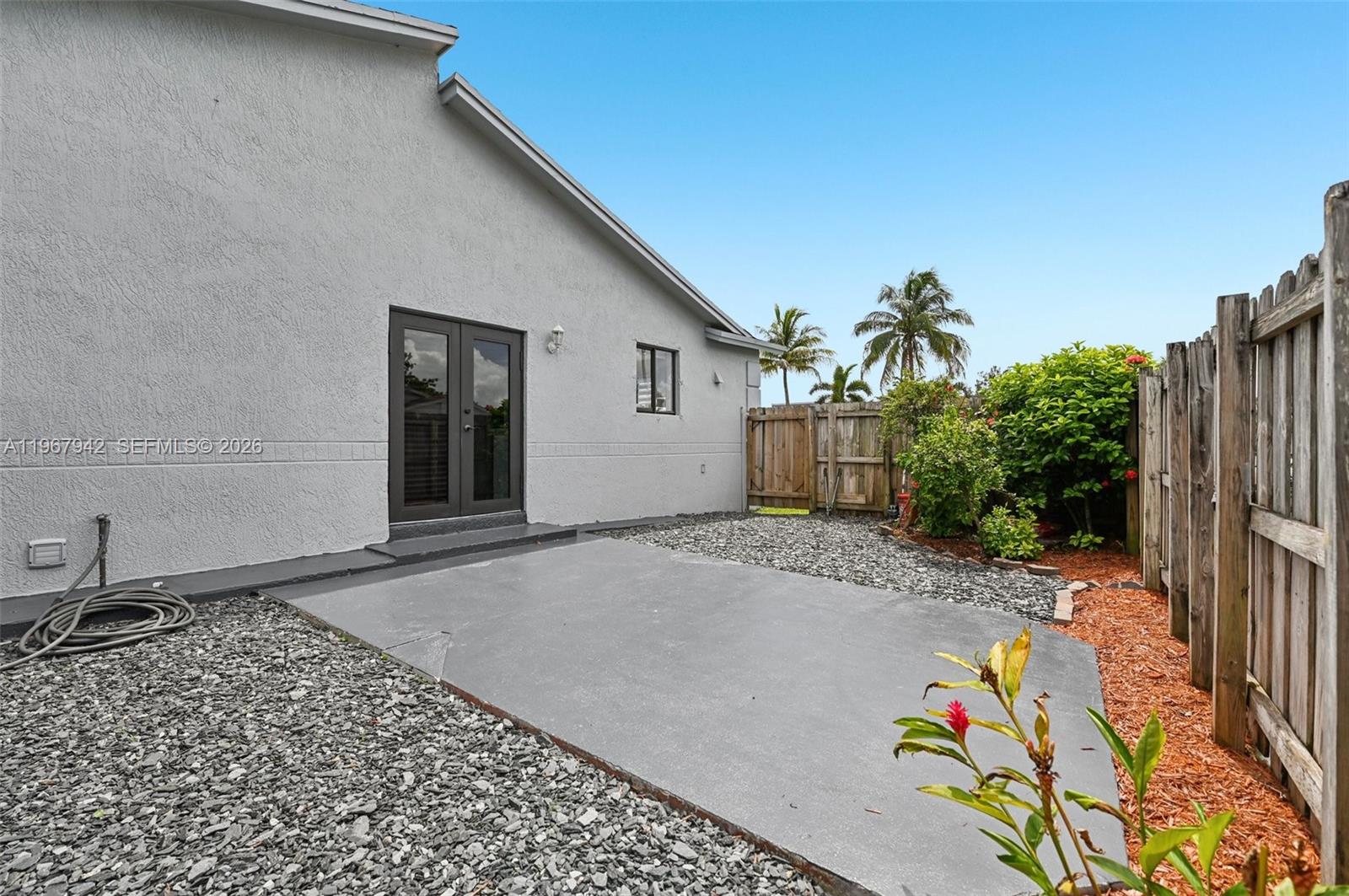 12237 Southwest 193rd Street Miami, FL 33177 - Photo 6 of 41 a view of a house with a backyard