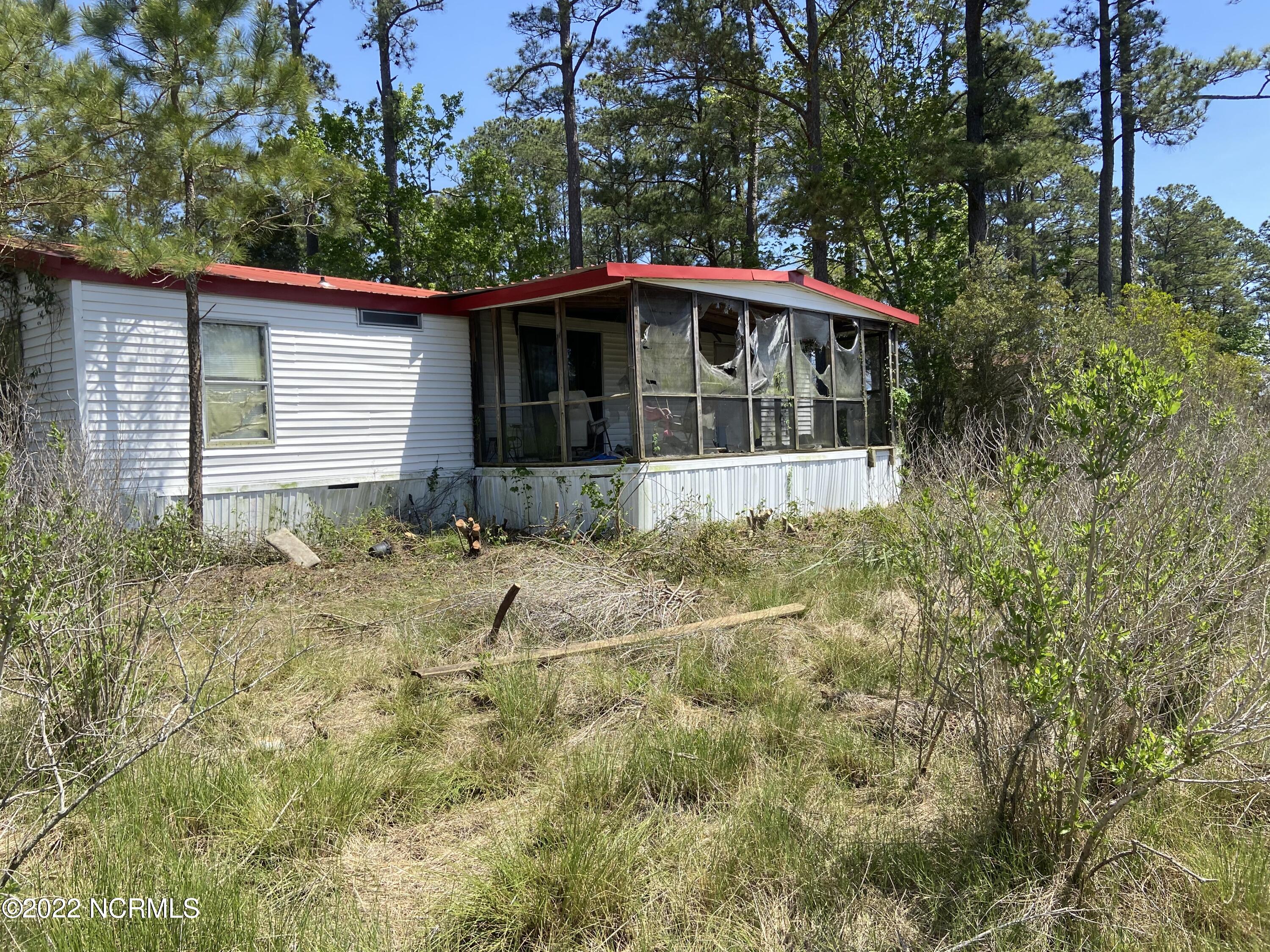 115 Hideaway Road Belhaven, NC 27810 - Photo 4 of 9 After Clearing Around Trailer