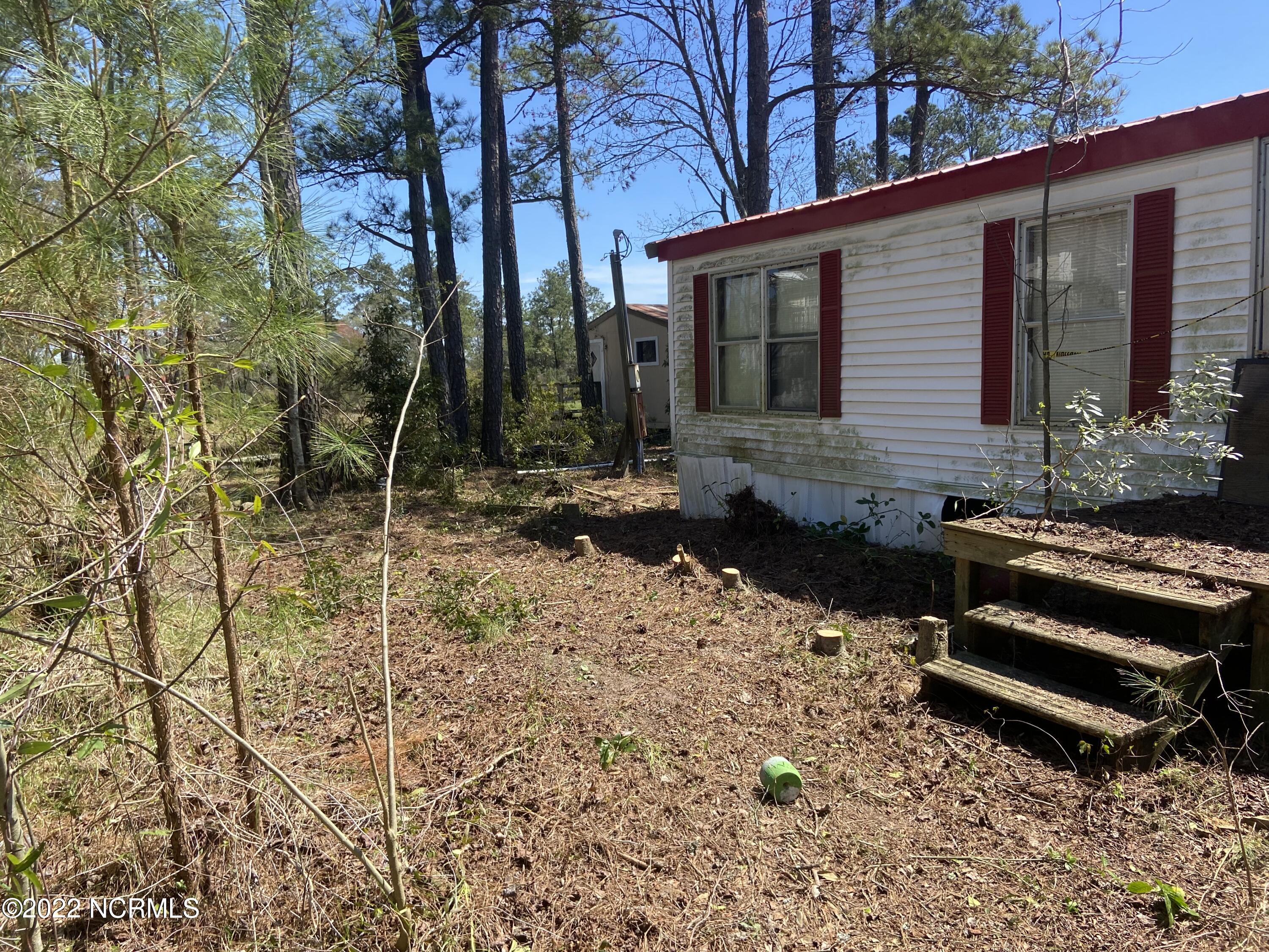 115 Hideaway Road Belhaven, NC 27810 - Photo 5 of 9 After Clearing Around Trailer