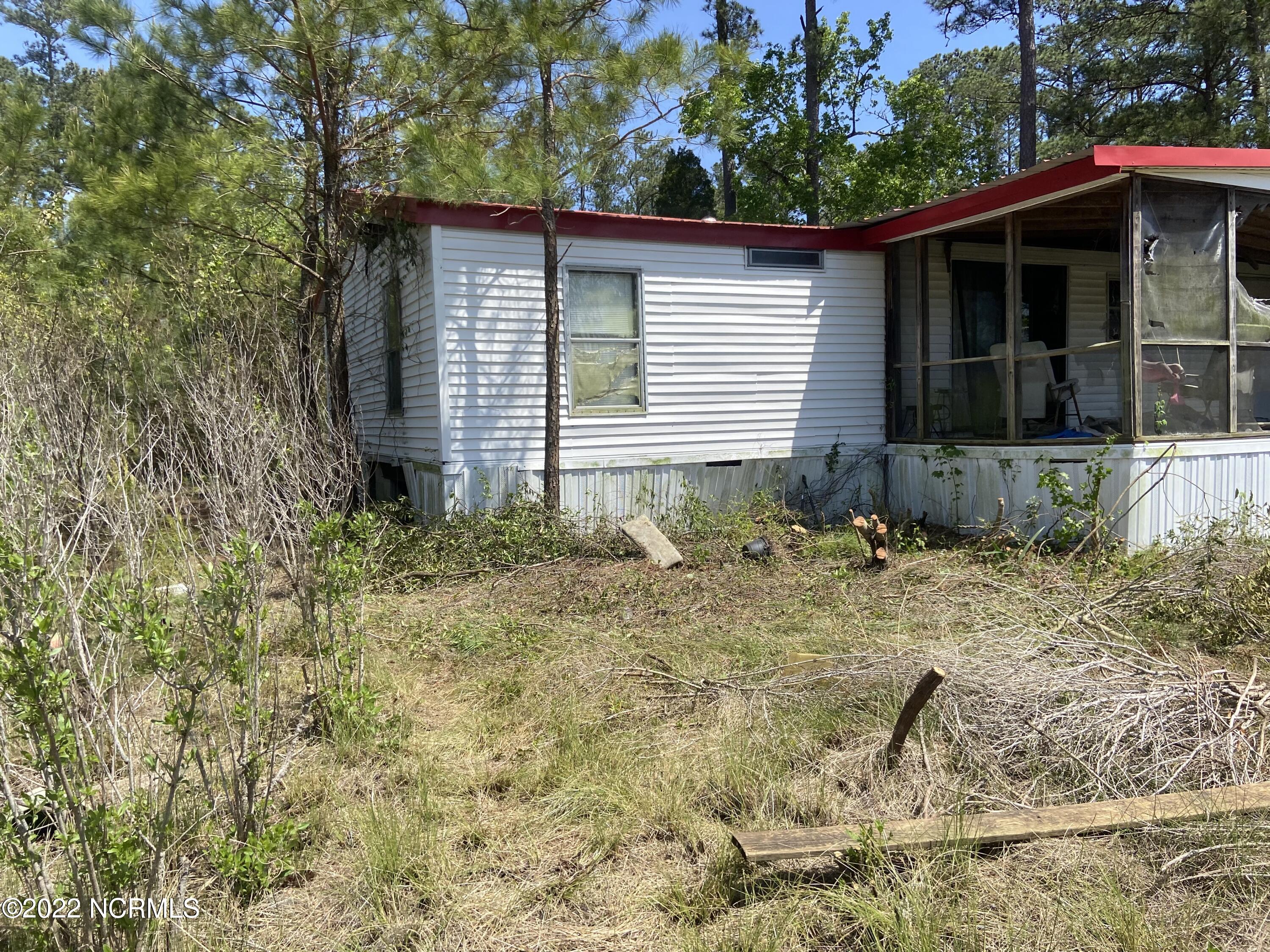 115 Hideaway Road Belhaven, NC 27810 - Photo 6 of 9 After Clearing Around Trailer