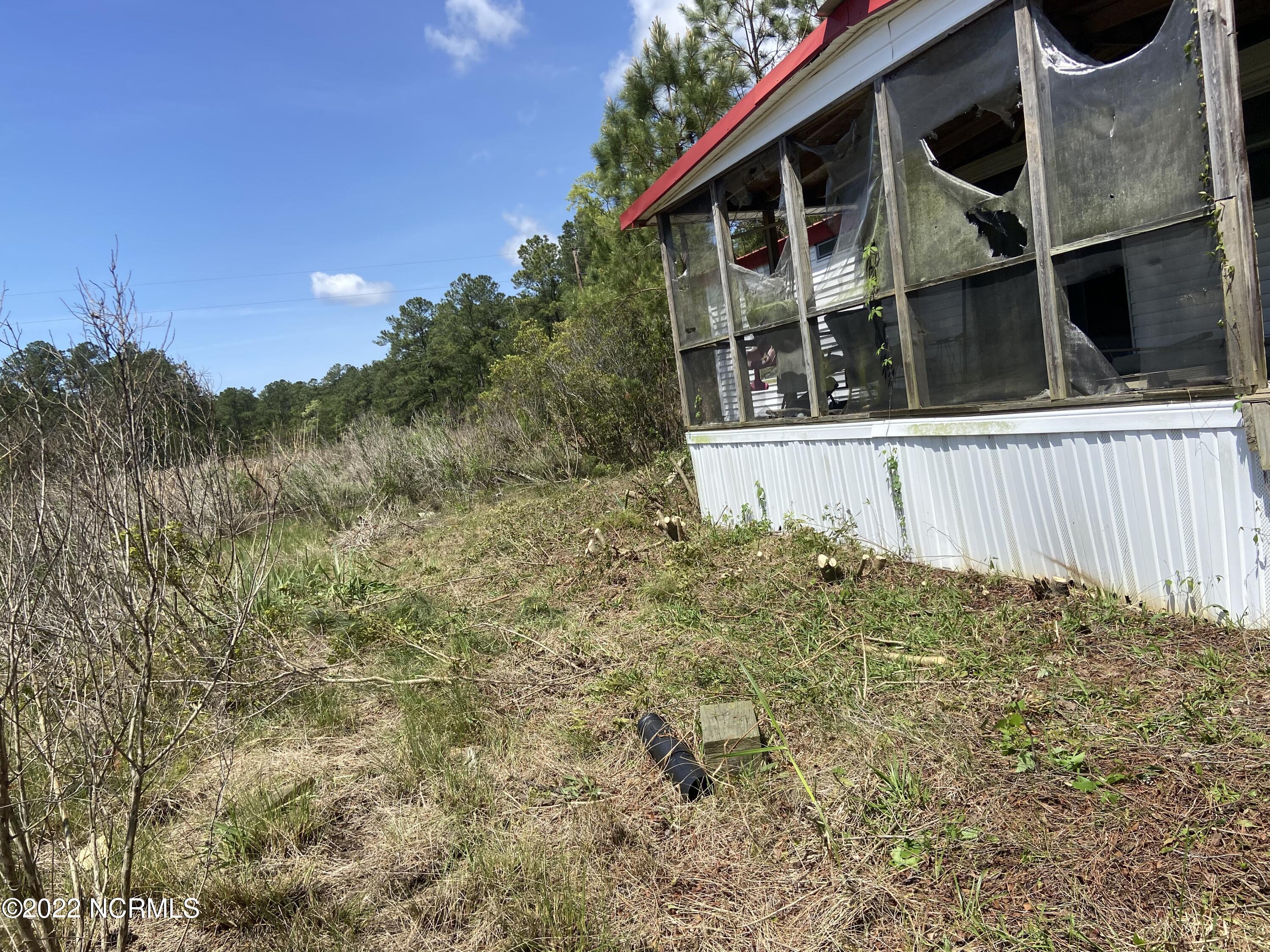 115 Hideaway Road Belhaven, NC 27810 - Photo 7 of 9 After Clearing Around Trailer