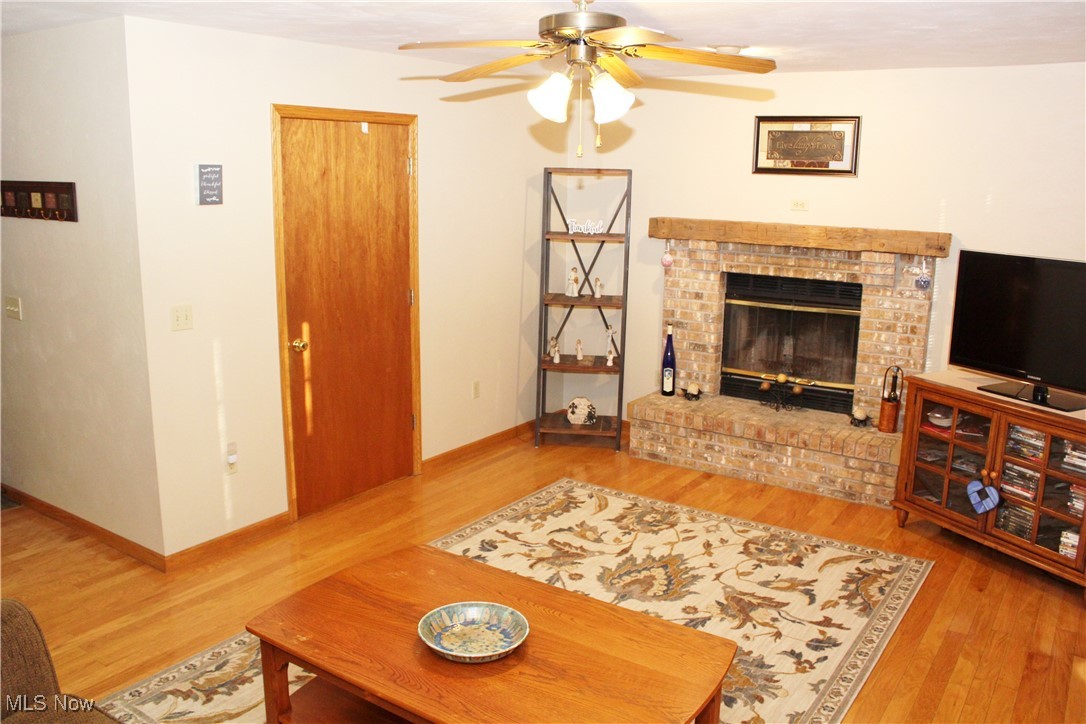 Family Room with Fireplace & Hardwood Flooring