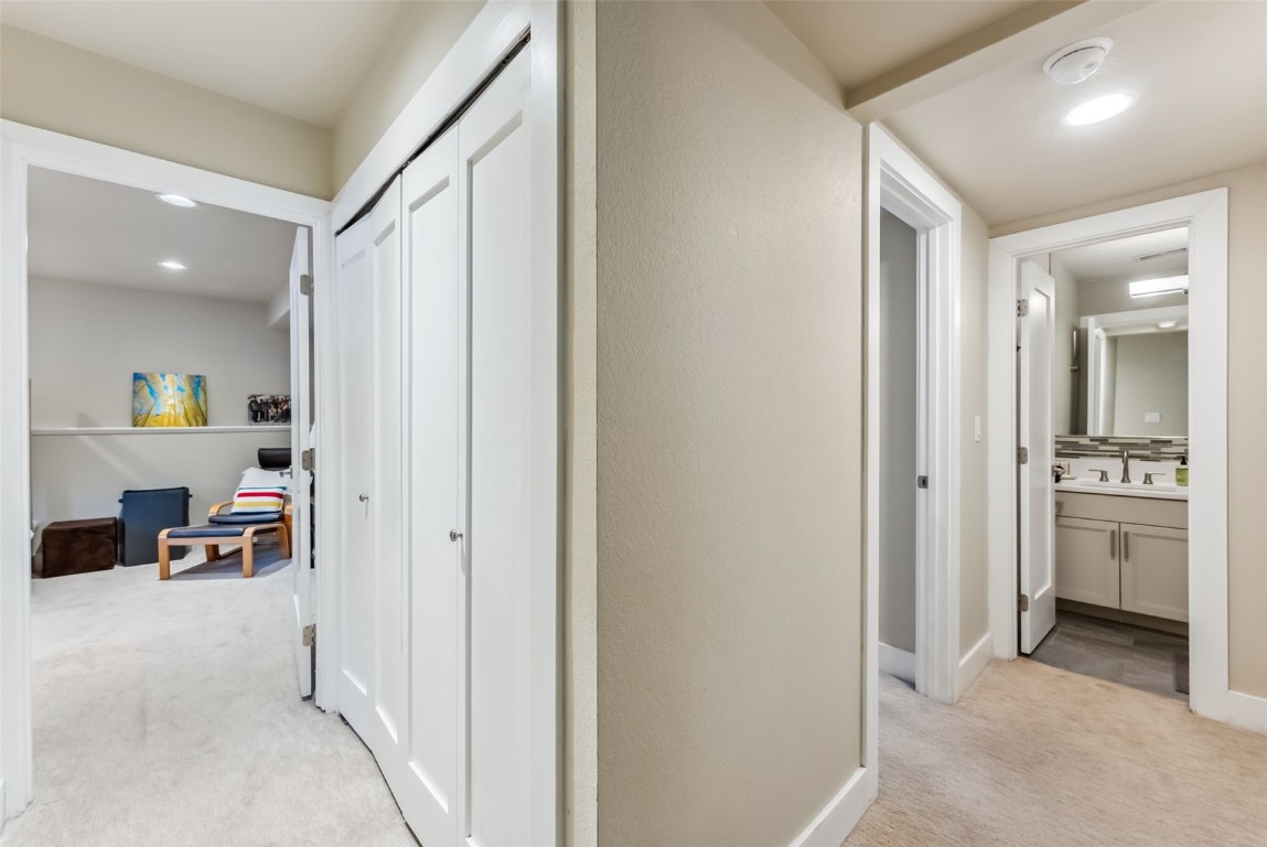 563 Bills Ranch Road Frisco, CO 80443 - Photo 25 of 50 Hallway featuring light colored carpet, recessed lighting, a sink, and baseboards