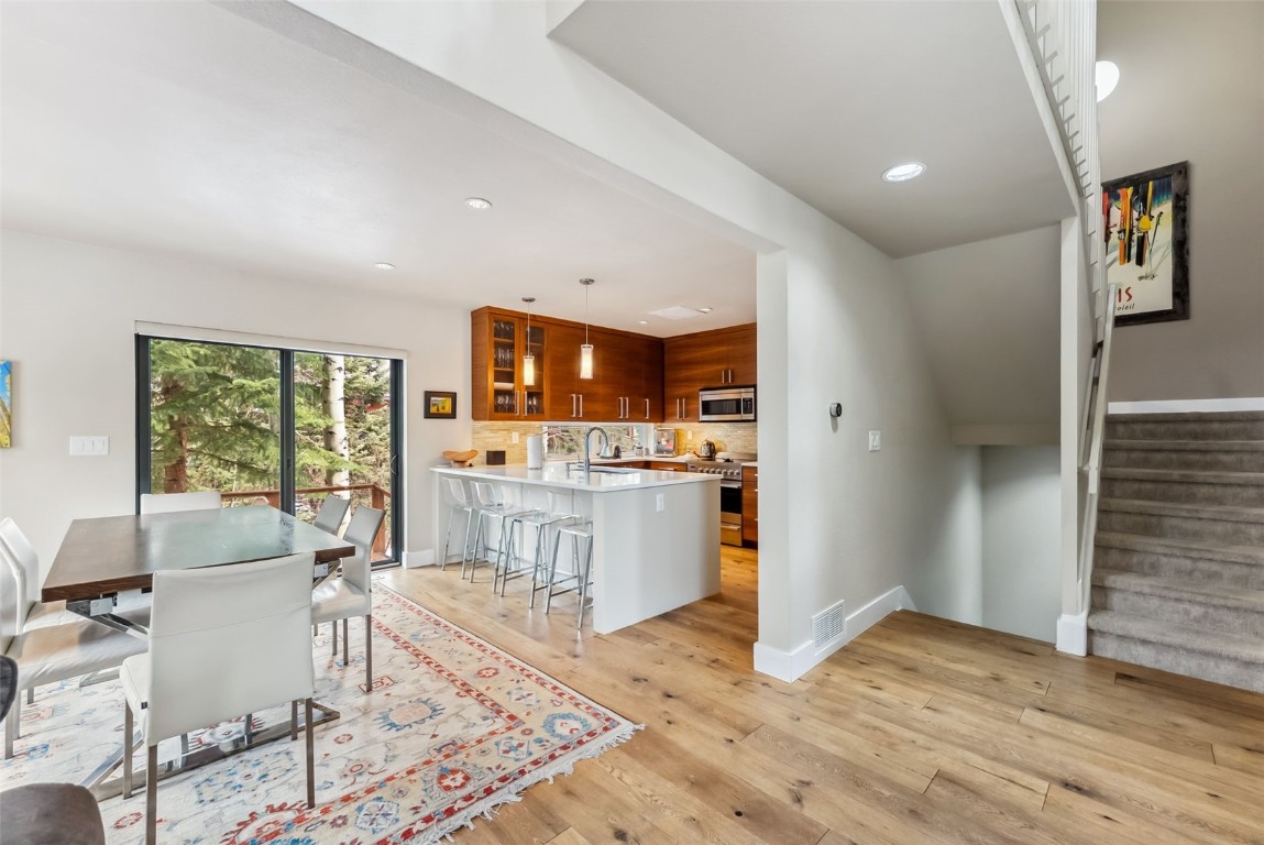 563 Bills Ranch Road Frisco, CO 80443 - Photo 6 of 50 Dining room featuring baseboards, light wood-type flooring, stairway, and recessed lighting