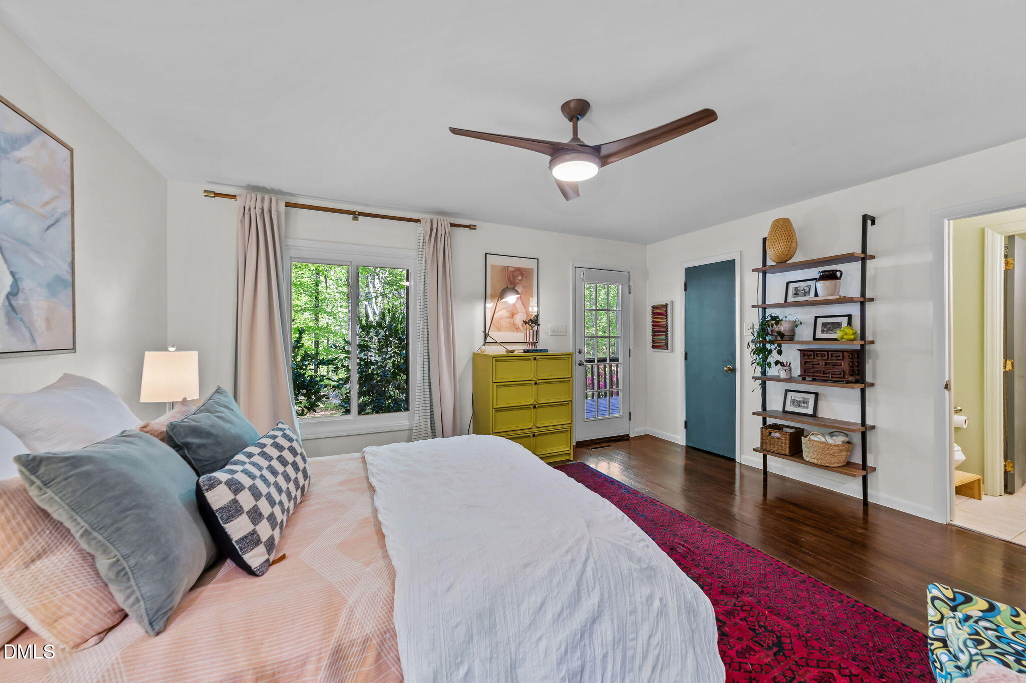 105 Barcliff Terrace Cary, NC 27518 - Photo 19 of 47 a spacious bedroom with a bed a dresser and a large window