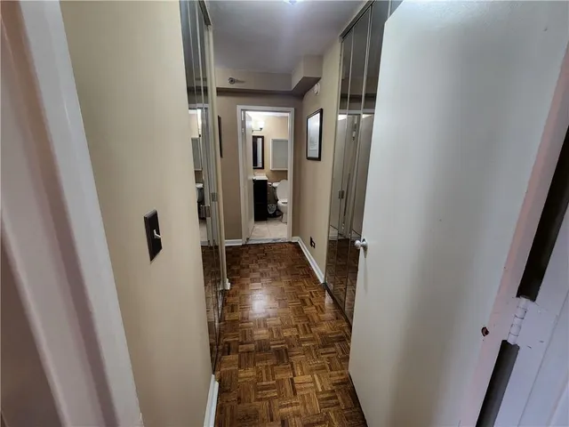 a bathroom with a toilet and a shower curtain